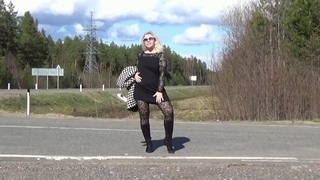 Business lady flashing on the road